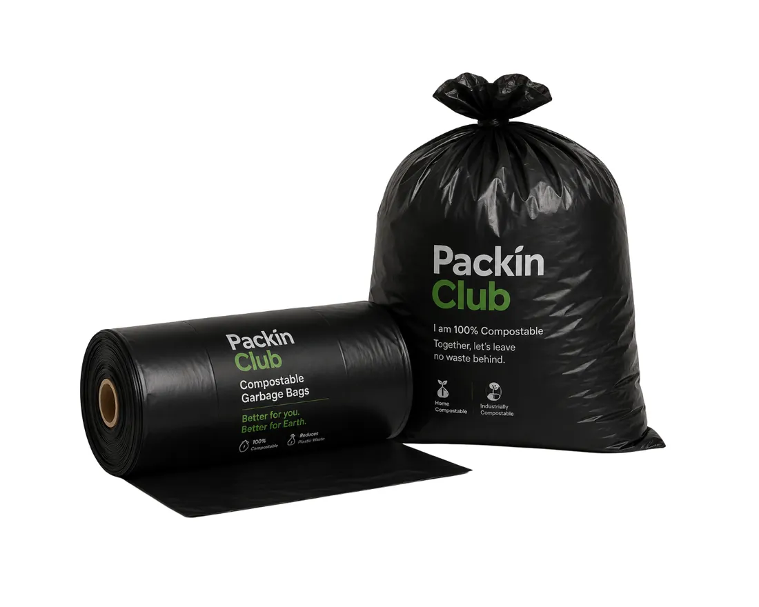 Roll of black Packin Club compostable garbage bags next to a full, knotted black bag